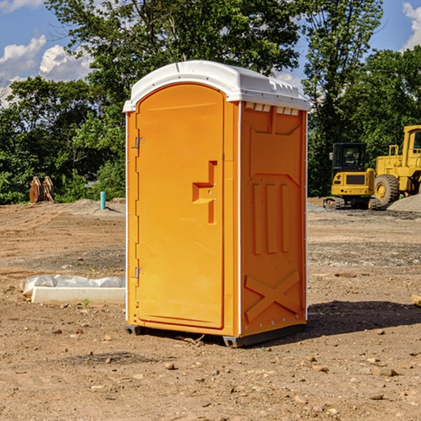 what is the cost difference between standard and deluxe portable toilet rentals in Clayville